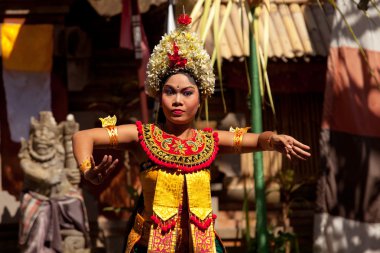 BALI, INDONESIA  APRIL 9: Young girl performs a classic national Balinese dance formal wear on April 9, 2012 on Bali, Indonesia. formal wear is very popular cultural show on Bali.